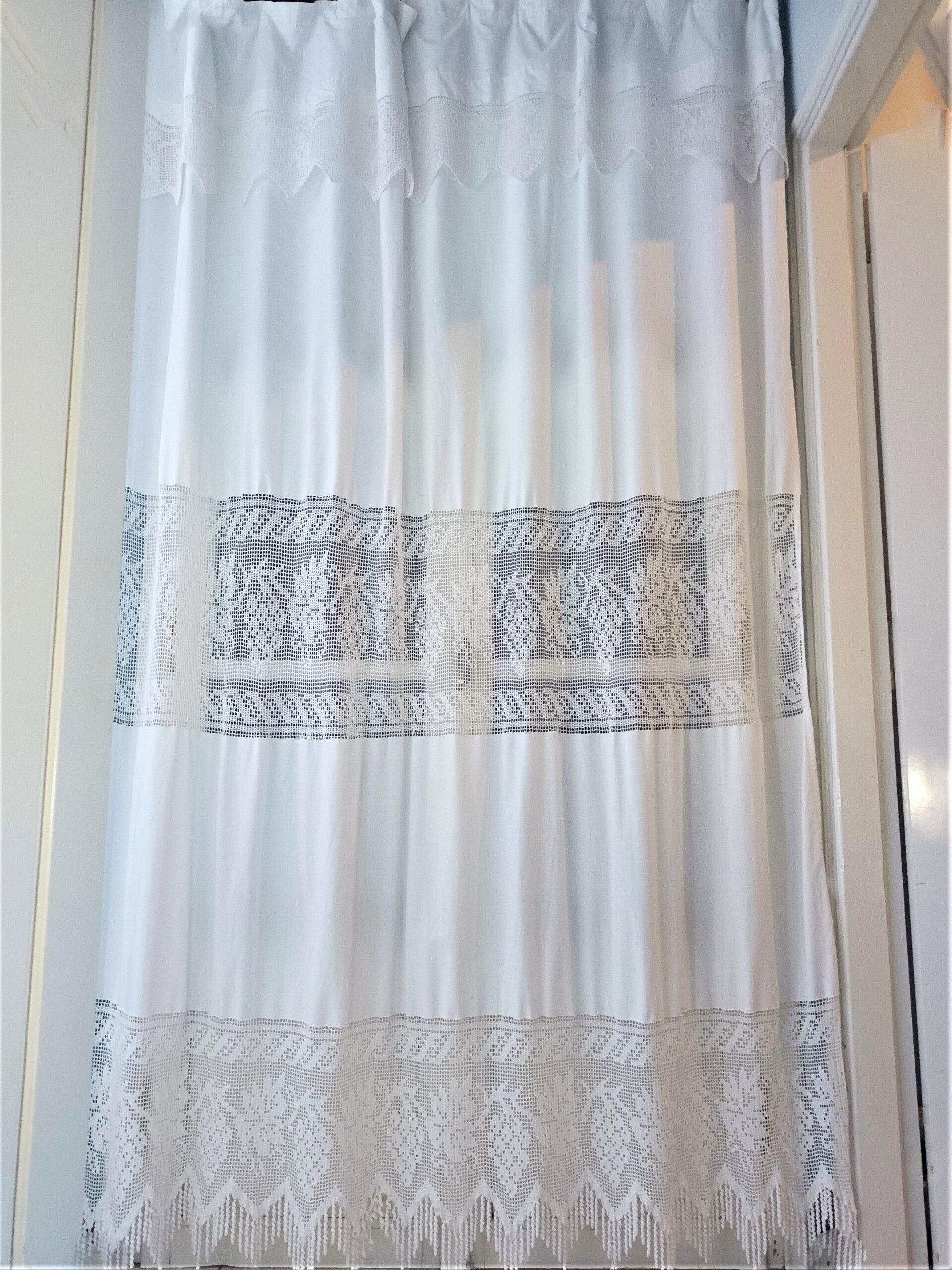 Big handmade curtain with cotton fabric and crochet in white. The pattern is grapes. At the bottom beautiful friges complete the style. Handmade artpiece from Greek woman. Suitable for double window in normal size.