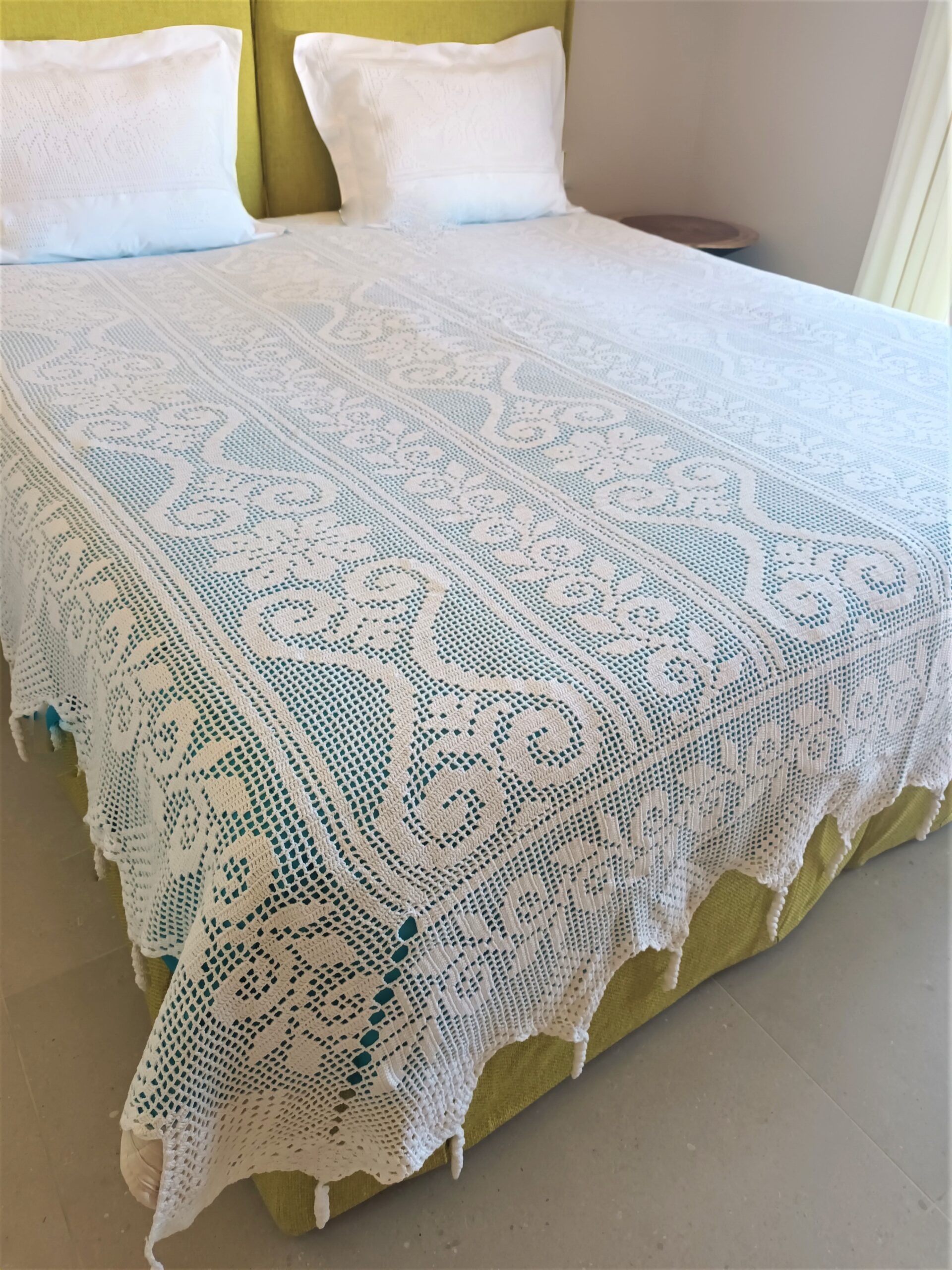 Handmade bed covers and pillows made with crochet and cotton in white