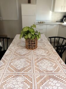 Tableclothe knitted with crochet in white 100% cotton thread. It is suitable for big dinning tables. Handmade from Greek woman